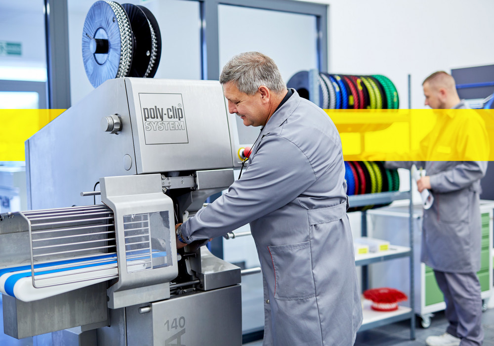 service employee working in front of machine consumables 